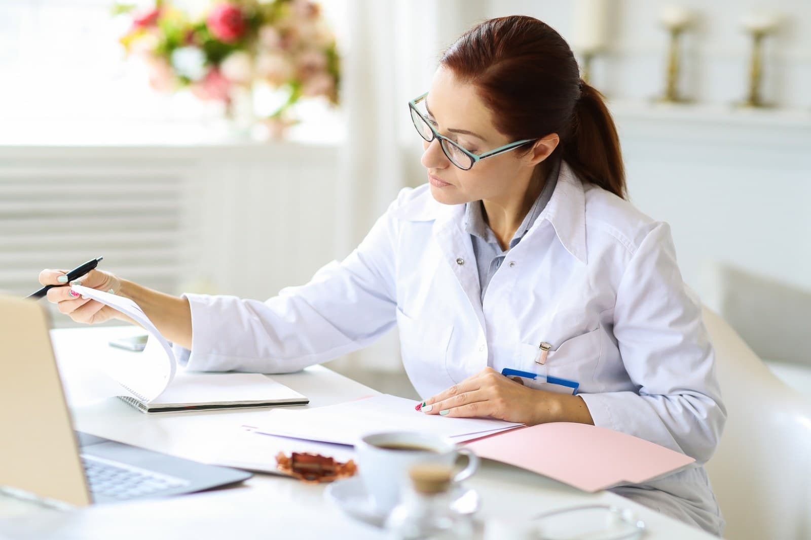 Dental office manager reviewing waterline test records